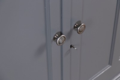 door-and-silver-knob-close-up-with-key